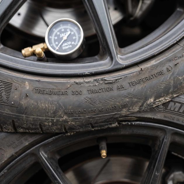 Performance tire sidewall with 300 treadwear rating ideal for street use close-up of a performance tire sidewall showing treadwear rating and speed rating markings