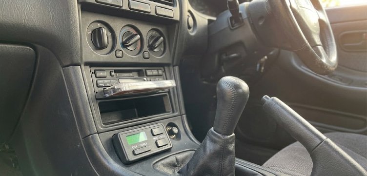 Switchable boost maps for family driving and solo driving boost controller with low and high boost settings visible in the interior of a street car