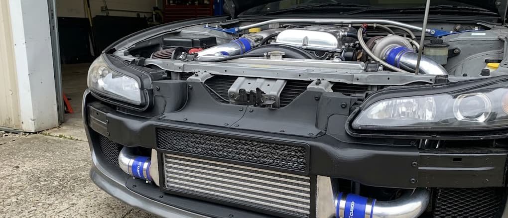 properly sized tube-and-fin intercooler with custom ABS ducting installed in a street car